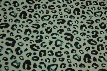 B-Ware 50 cm French Terry Leoprint, smaragd, schwarz